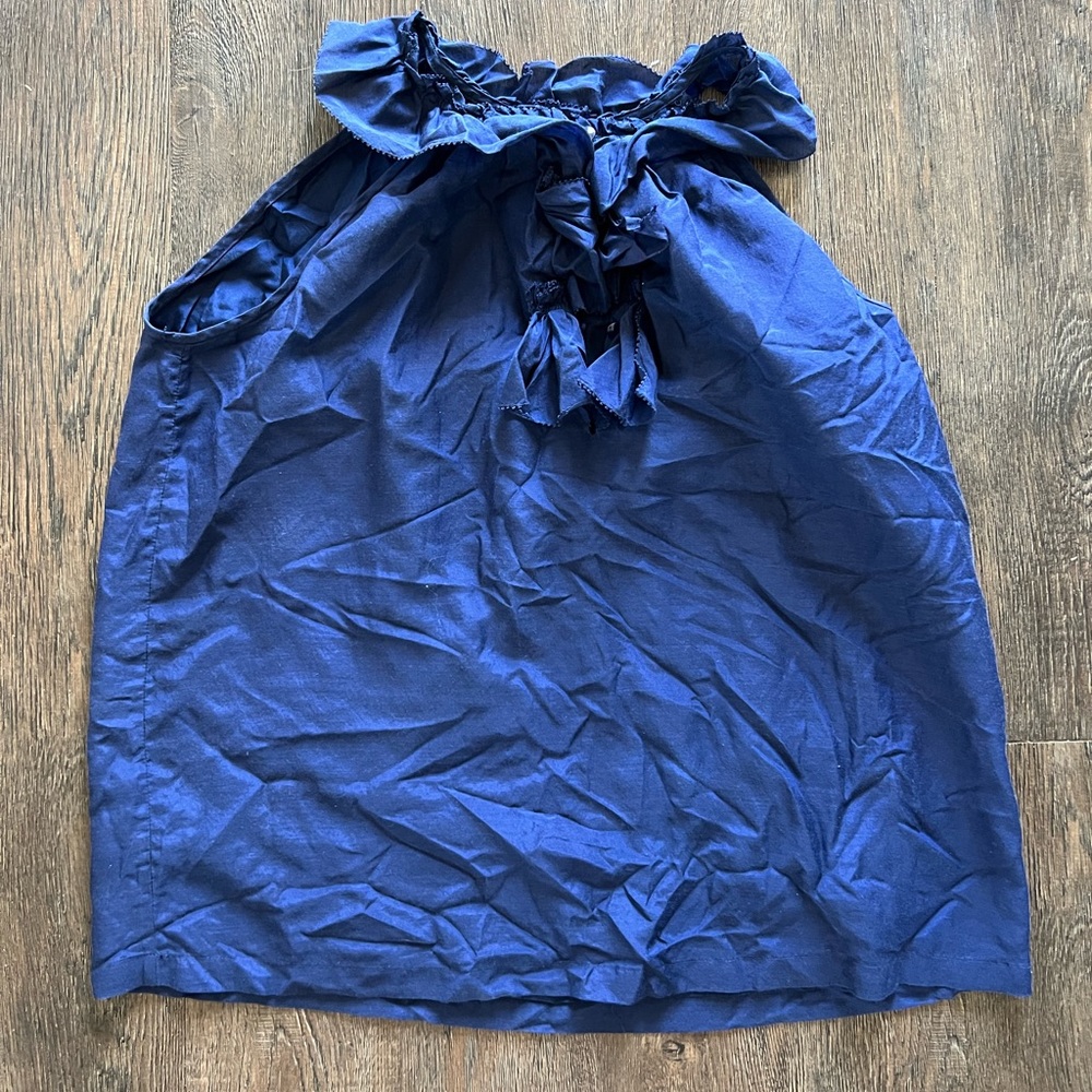 Size small J Crew Navy silk sleeveless top. Super cute.  Buttons and ruffle neck